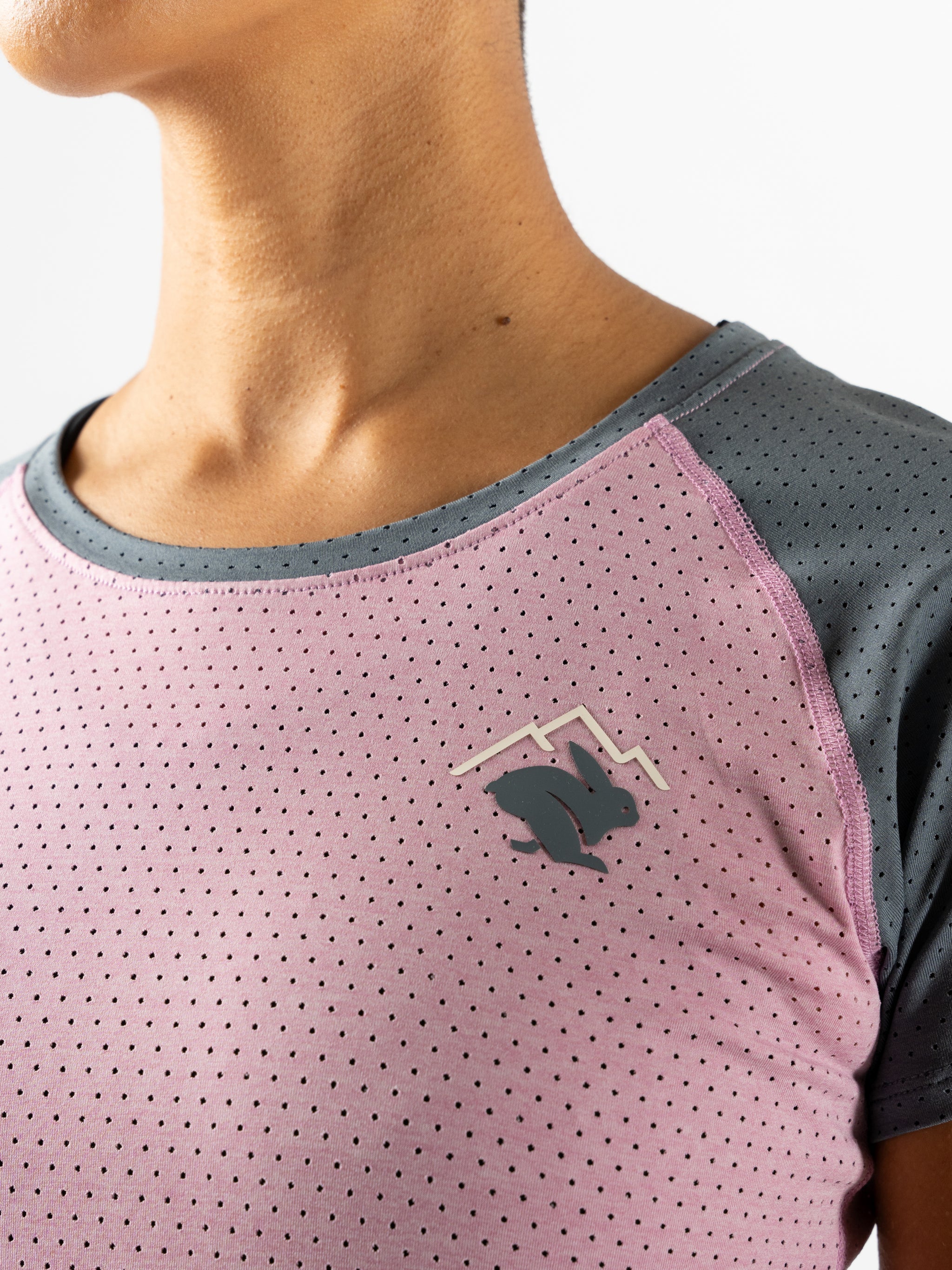 EZ Tee Perf SS Trail - Women by Rabbit in pink and dark grey, lightweight breathable trail running top with perforations for enhanced airflow