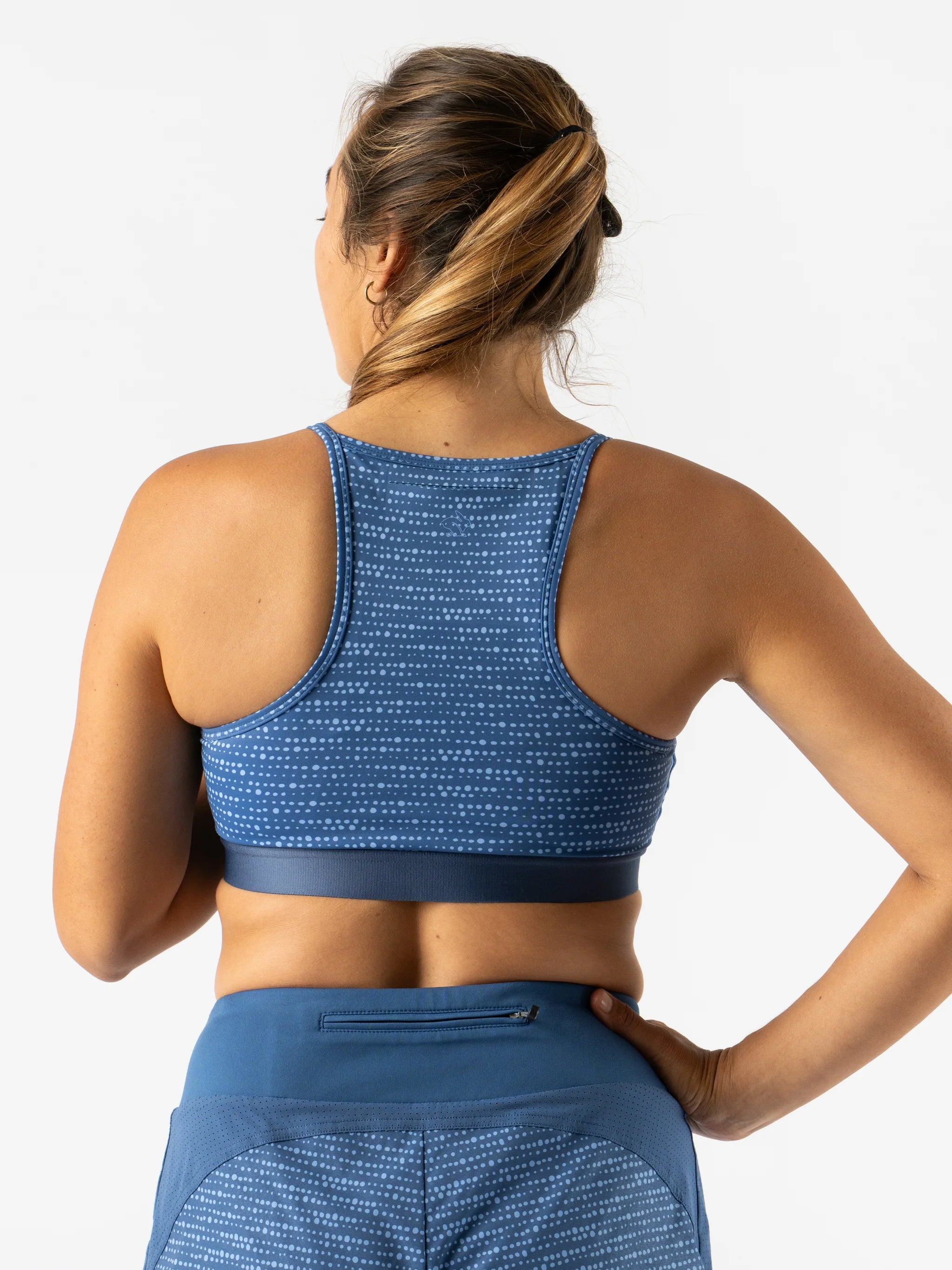 Strappy Pocket Bra - Women by Rabbit in blue with built-in pocket, minimal bounce, and breathable design for secure comfort during running