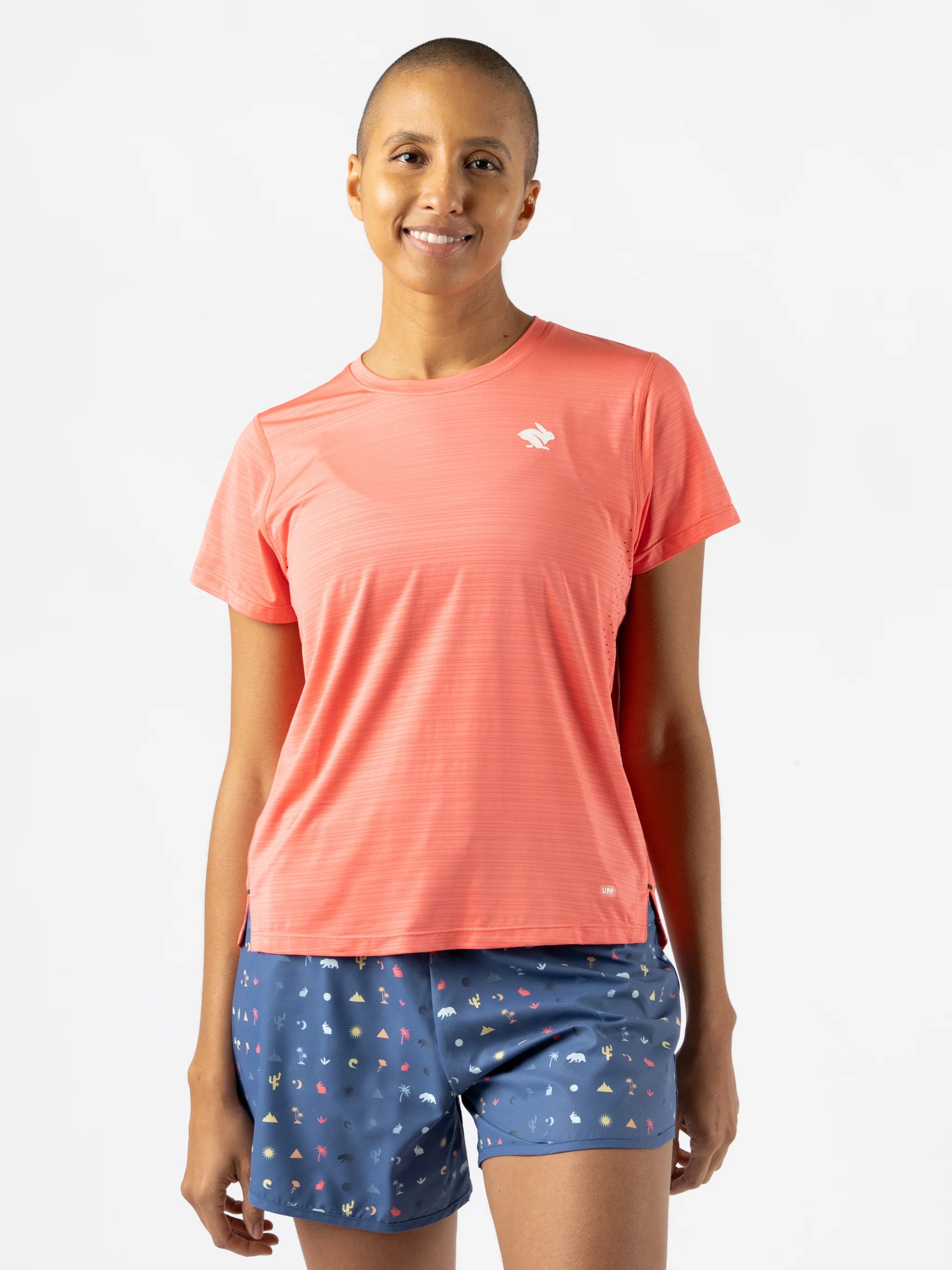 UPF Tee SS - Women by Rabbit in coral with laser-cut perfs, ultra lightweight jersey, UPF 50 sun protection, ideal for running and outdoor use