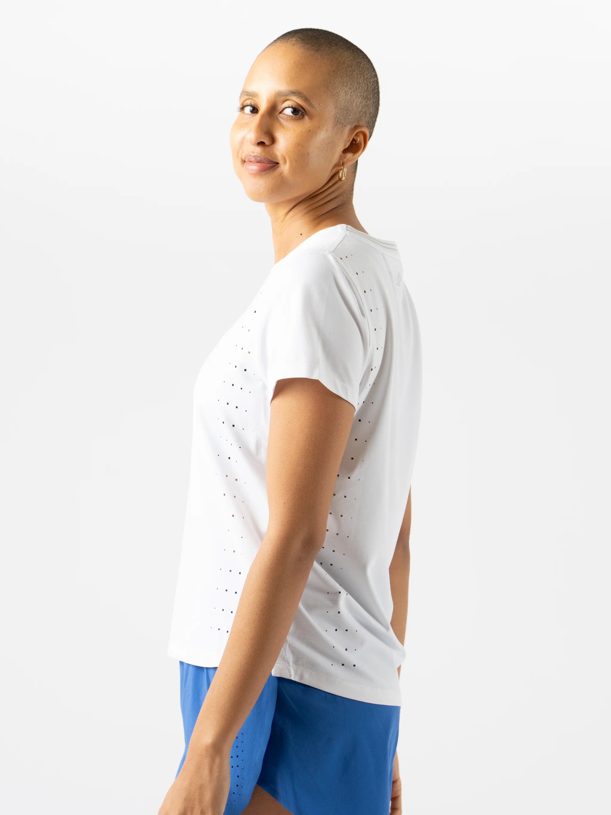 Race Pace Tee SS - Women by Rabbit in white with laser-cut perforations for breathability, semi-relaxed fit for running and training comfort
