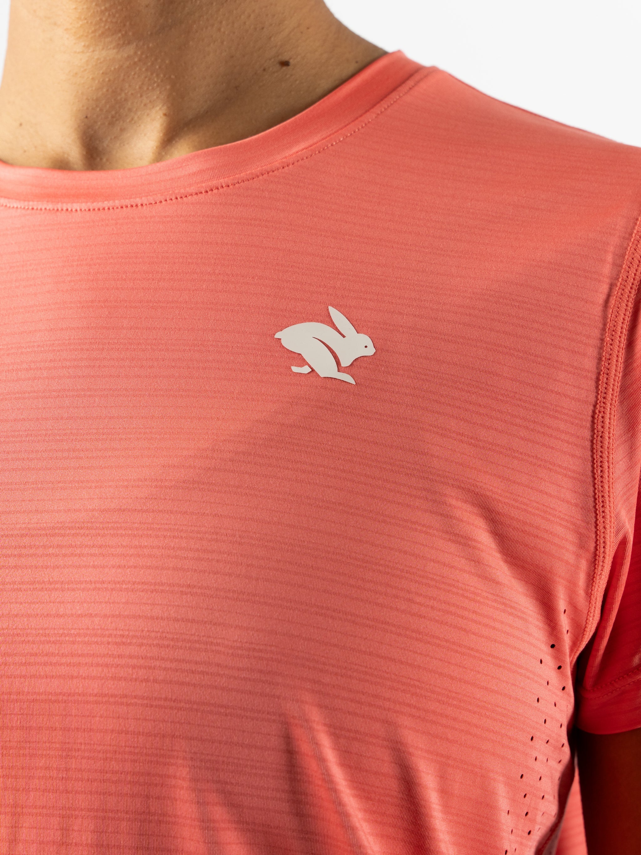UPF Tee SS - Women by Rabbit in coral pink, lightweight UPF 50 jersey with laser-cut vents for sun protection and breathability