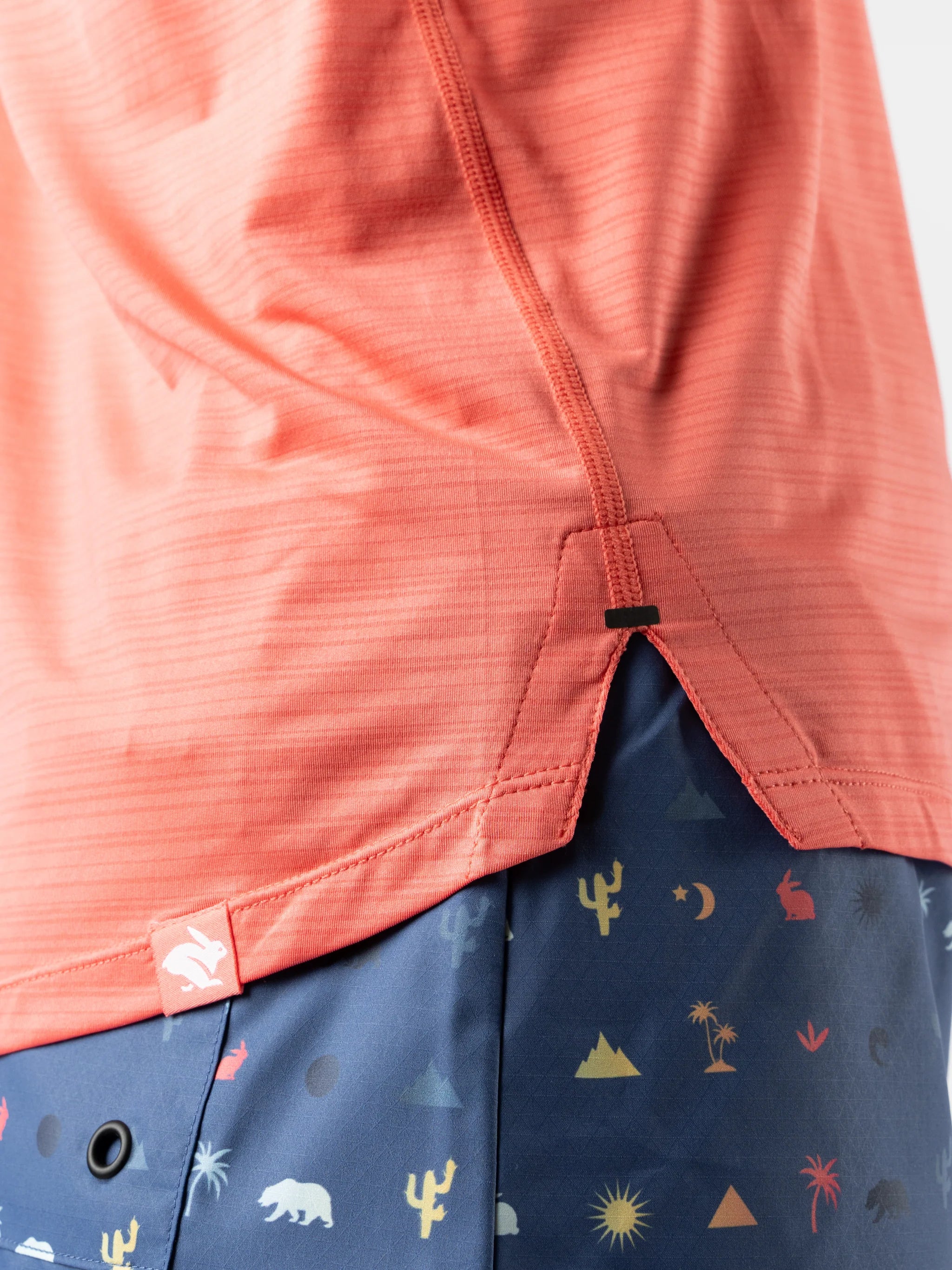 UPF Tee SS - Women by Rabbit in coral with lightweight jersey fabric and laser-cut vented perfs, breathable sun protective top for outdoor use