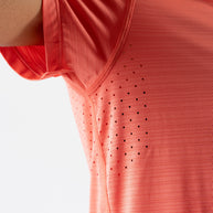 UPF Tee SS - Women by Rabbit in coral with laser-cut vented underarms, lightweight UPF 50 tee ideal for sun protection and running