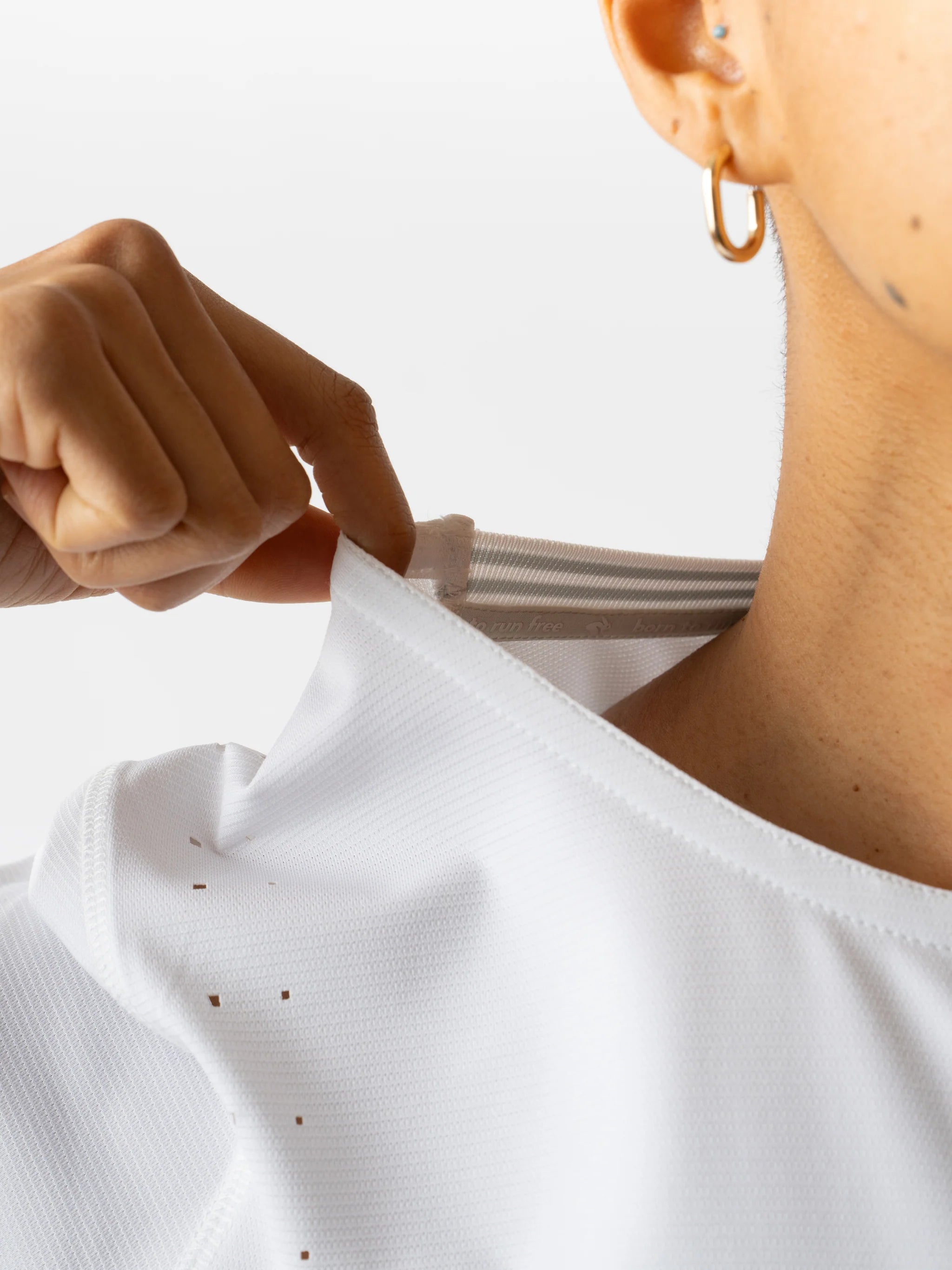 Race Pace Tee SS - Women by Rabbit in white with laser-cut perforations for breathability, semi-relaxed fit, ideal for running and training