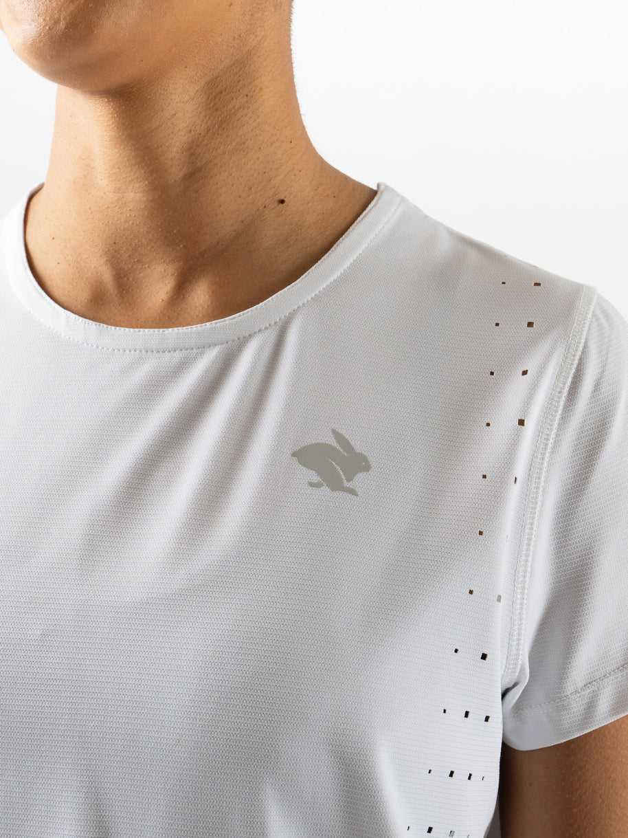 Race Pace Tee SS - Women by Rabbit in white with breathable laser-cut perforations and micro-textured inside for running comfort