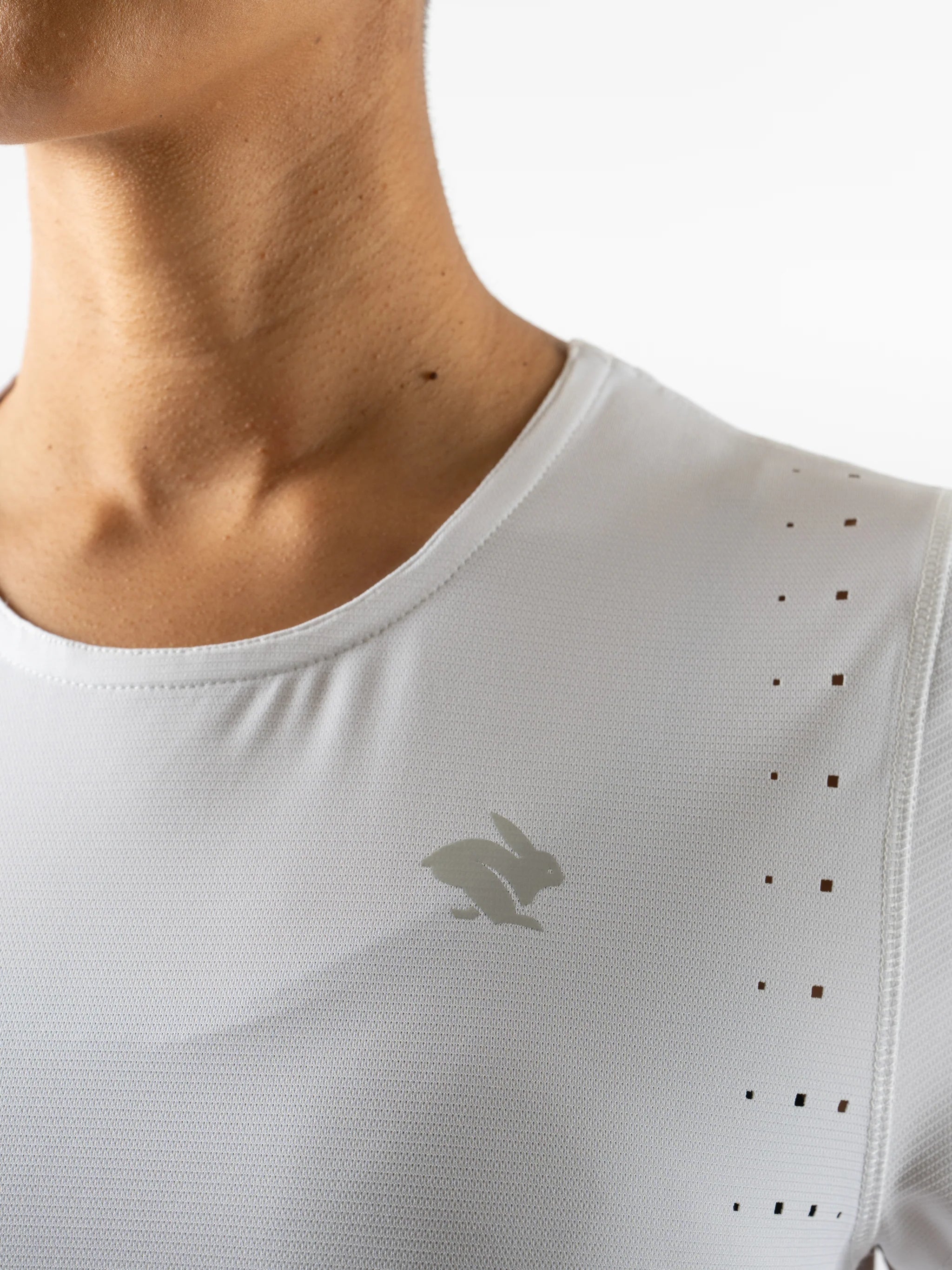 Race Pace Tee SS - Women by Rabbit in white with laser-cut perforations, breathable semi-relaxed running shirt ideal for training and racing