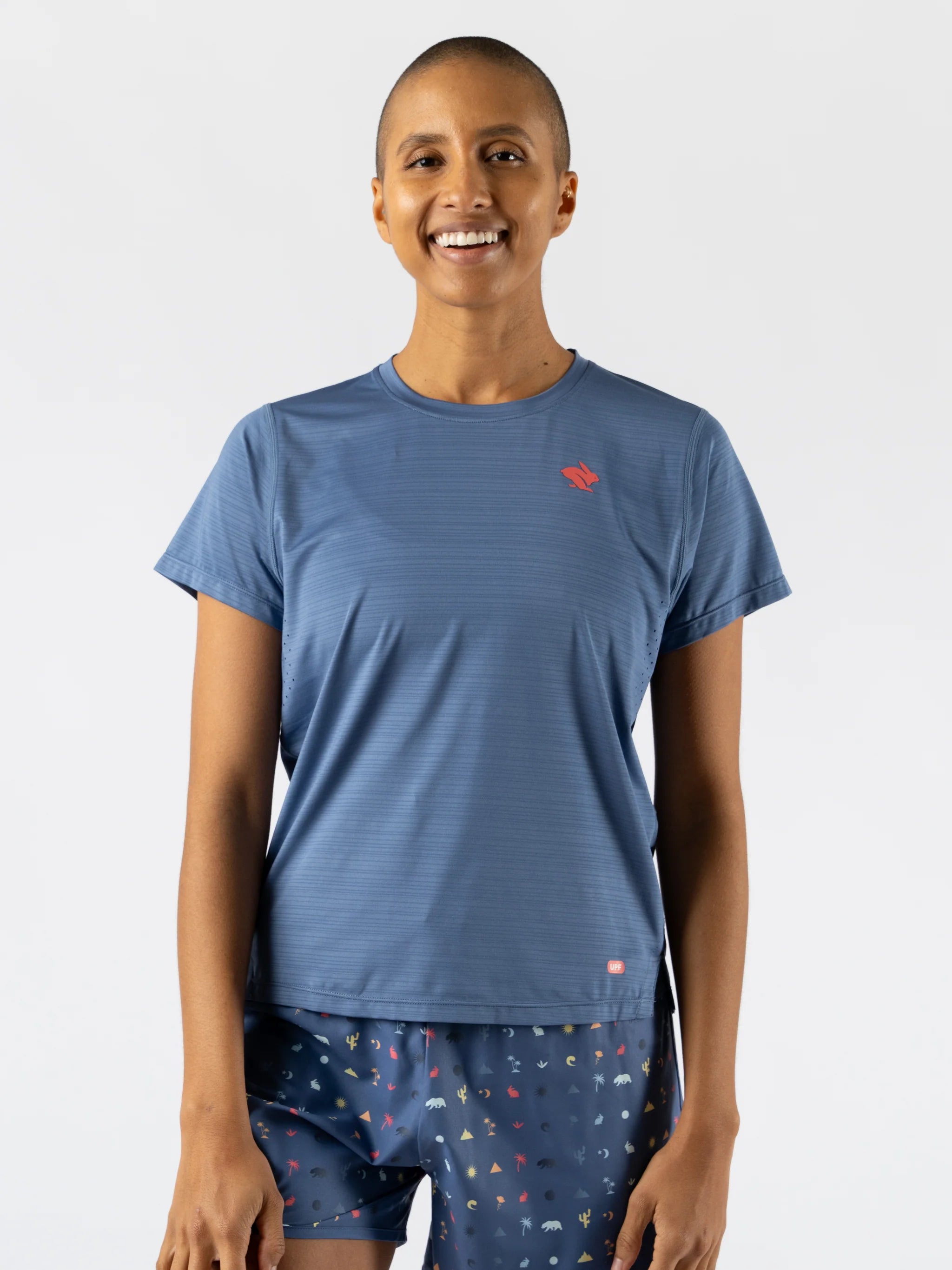 UPF Tee SS - Women by Rabbit in blue, lightweight jersey with laser-cut ventilation, UPF 50 protection for sun safety and running.