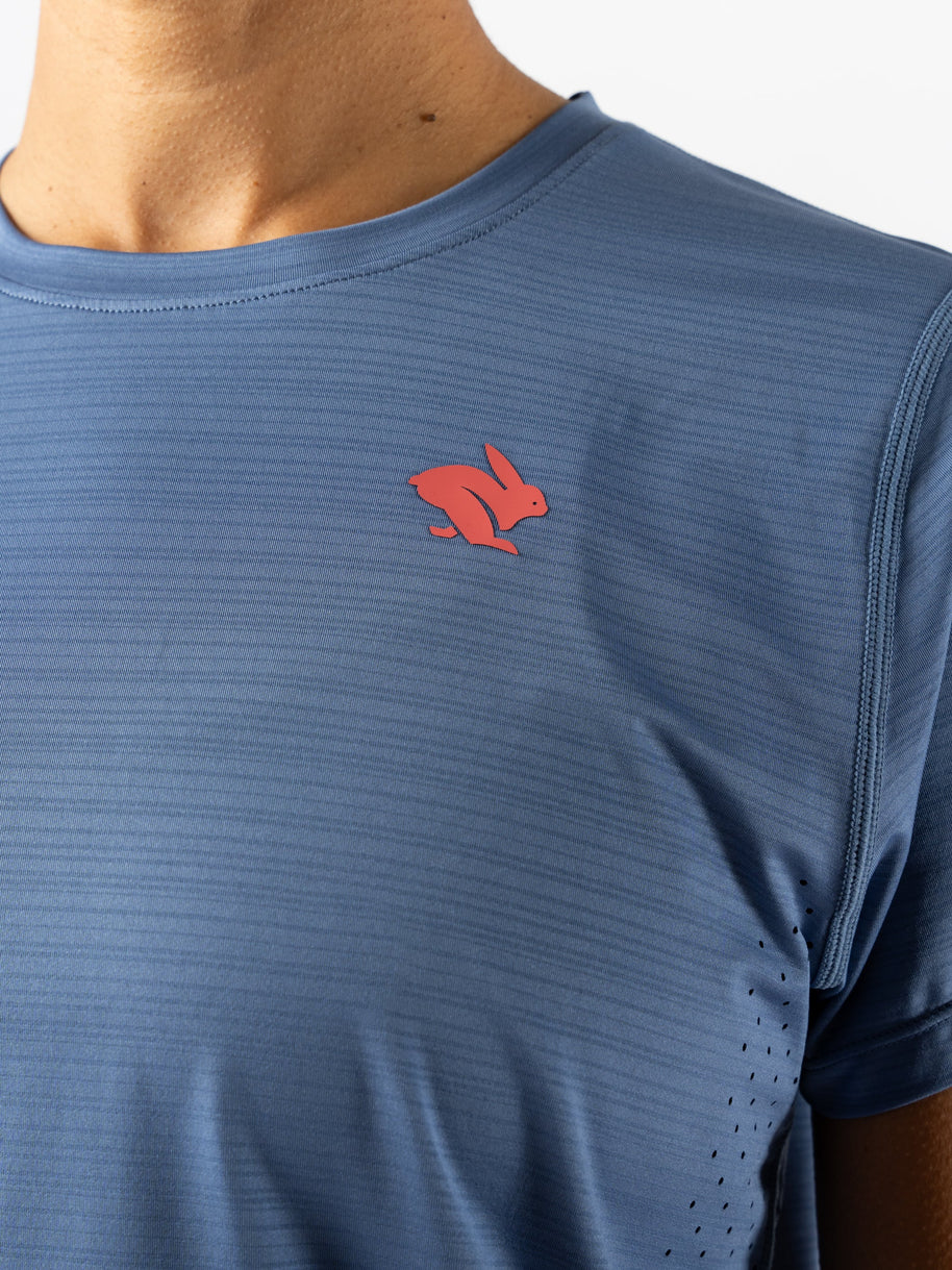 UPF Tee SS - Women by Rabbit in blue, lightweight breathable top with UPF 50 sun protection and laser-cut ventilation for outdoor running