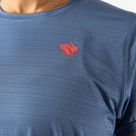 UPF Tee SS - Women by Rabbit in blue, lightweight breathable top with UPF 50 sun protection and laser-cut ventilation for outdoor running