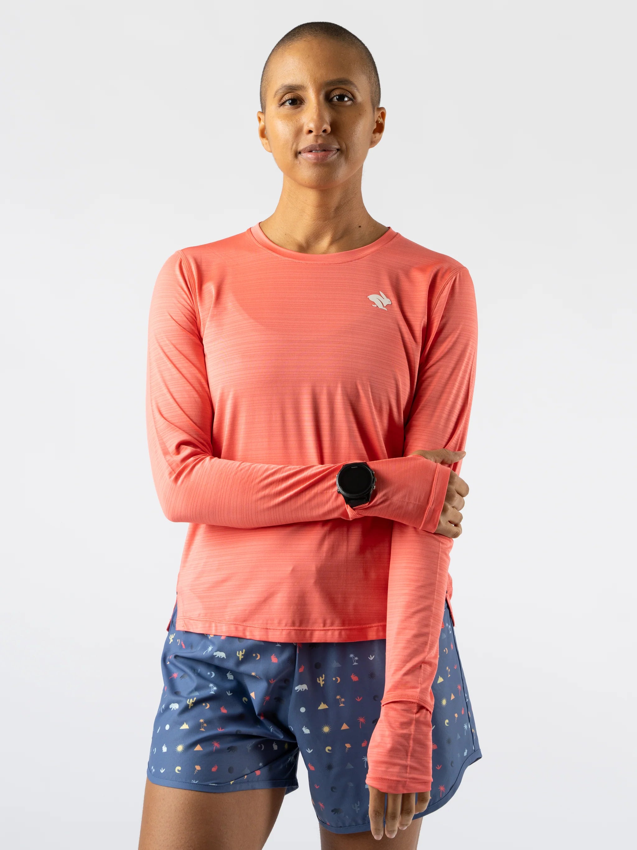 UPF Tee LS - Women by Rabbit in coral pink, ultralight UPF 50 long sleeve top, breathable and sun-protective for outdoor running