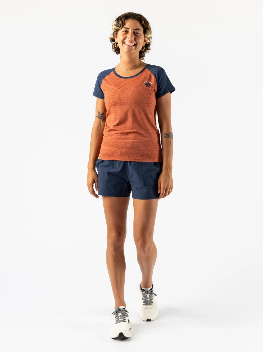 EZ Tee Perf SS Trail - Women by Rabbit in burnt orange and navy, breathable perforated running top ideal for trail running and outdoor activities