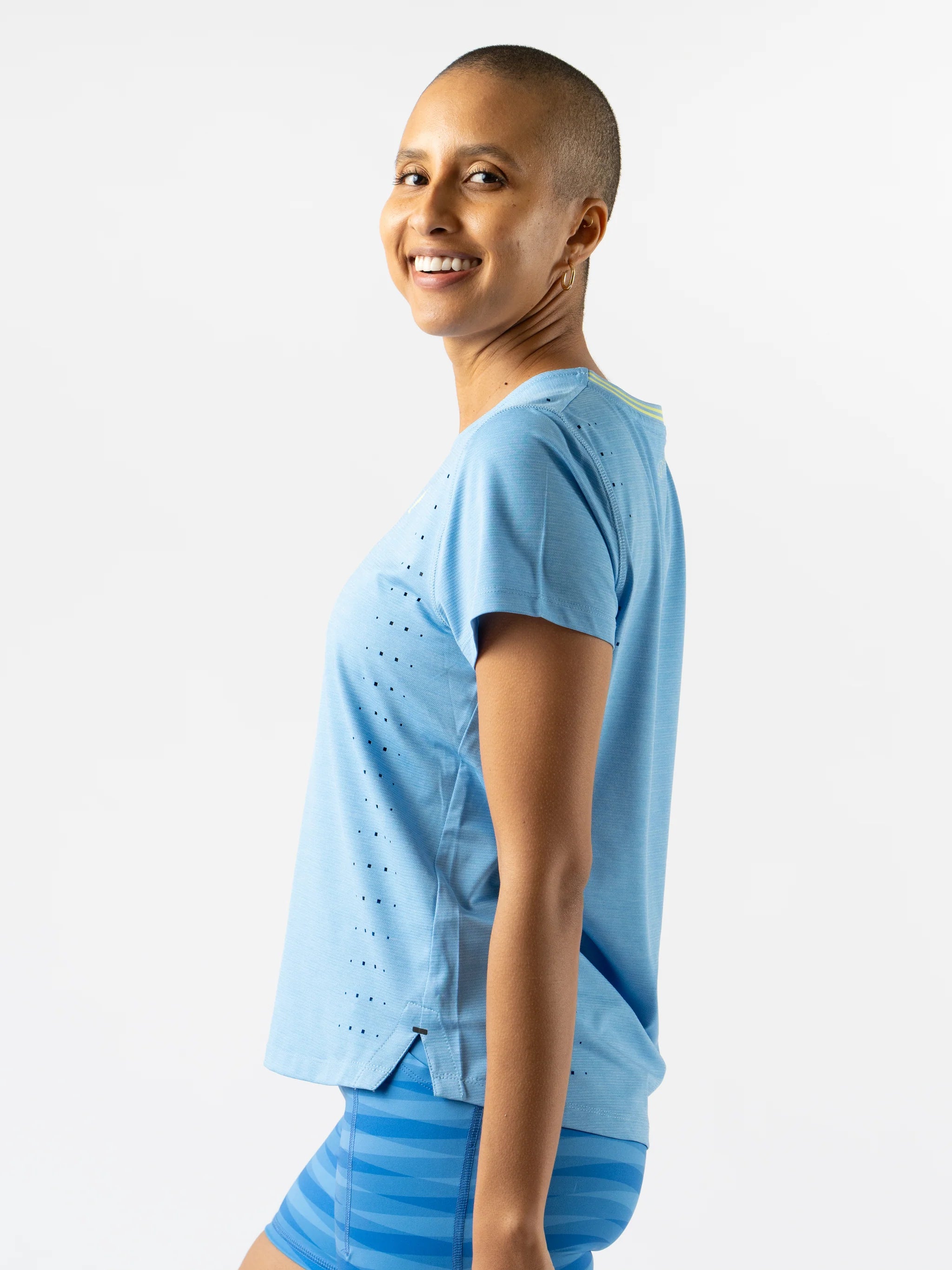 Race Pace Tee SS - Women by Rabbit in light blue with laser-cut perforations, breathable semi-relaxed running top for training and race day
