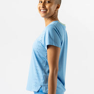 Race Pace Tee SS - Women by Rabbit in light blue with laser-cut perforations, breathable semi-relaxed running top for training and race day