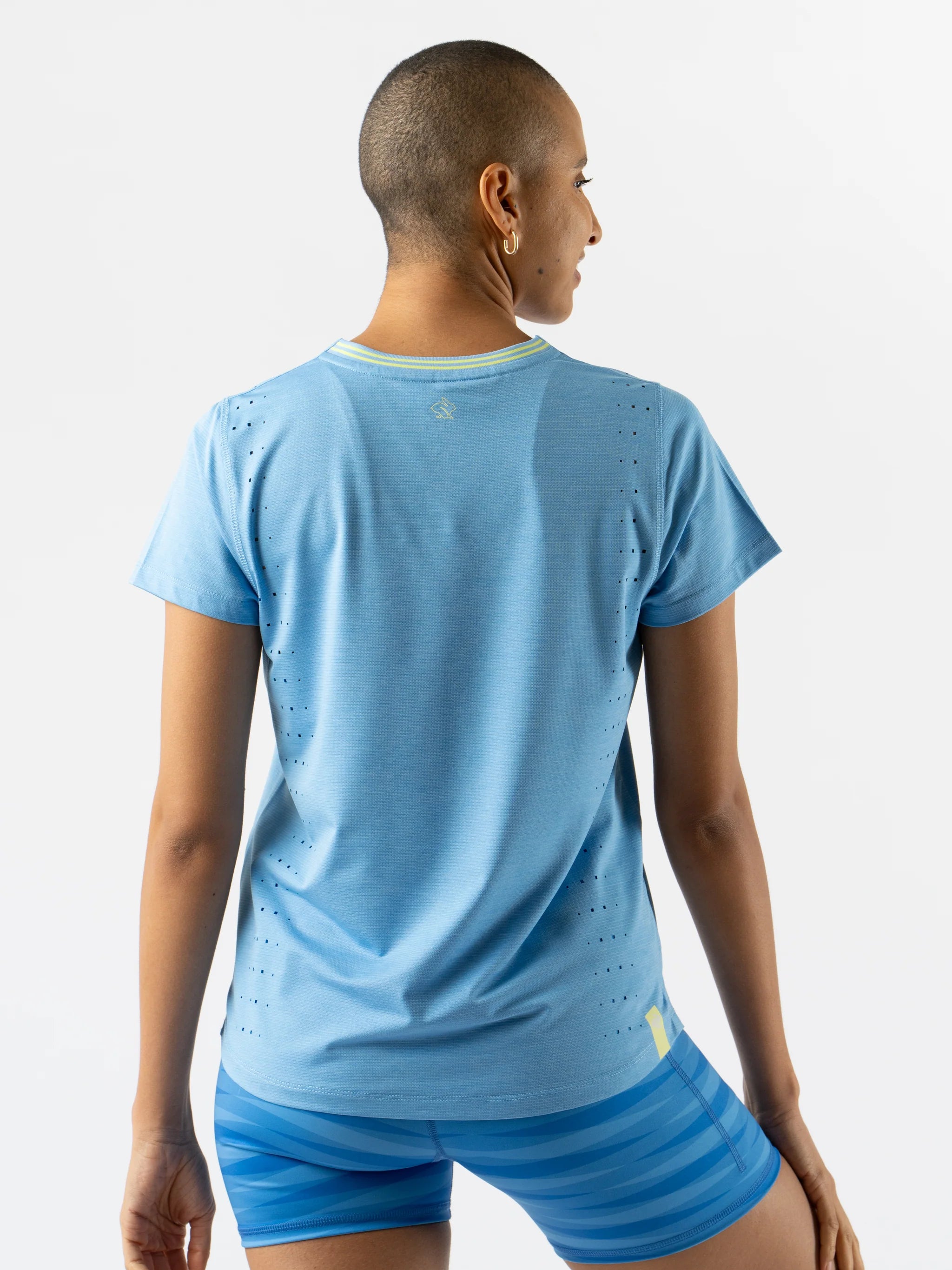 Race Pace Tee SS - Women by Rabbit in light blue with laser-cut perforations, breathable semi-relaxed running shirt for training and race day