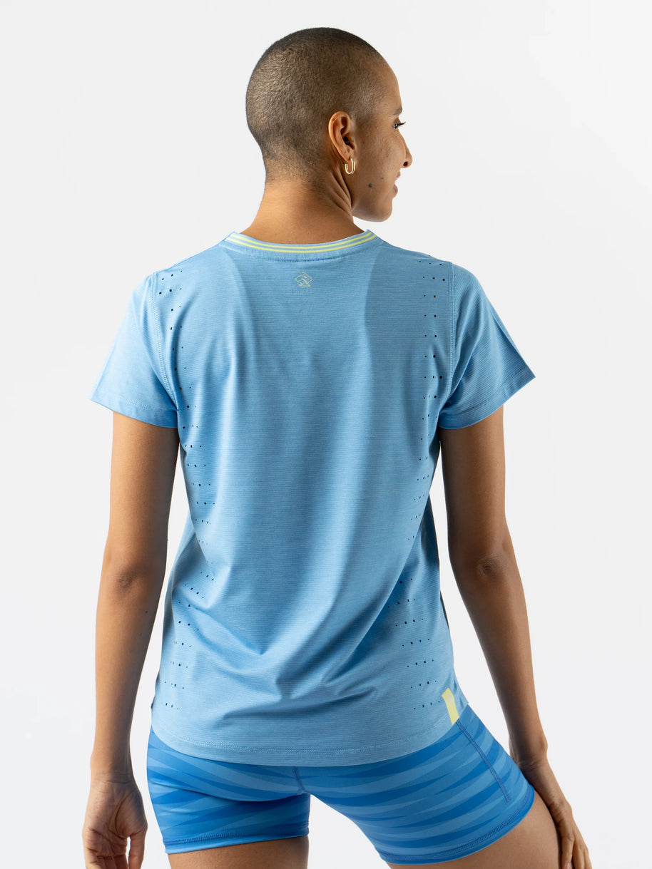 Race Pace Tee SS - Women by Rabbit in light blue with laser-cut perforations, breathable semi-relaxed running shirt for training and race day