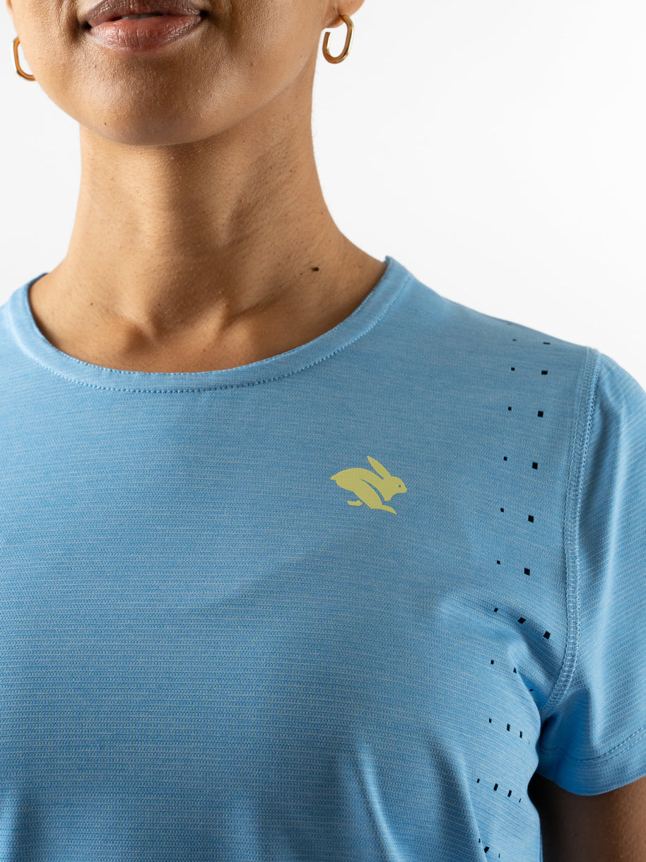 Race Pace Tee SS - Women by Rabbit in light blue with laser-cut perforations, breathable semi-relaxed running shirt for training and races