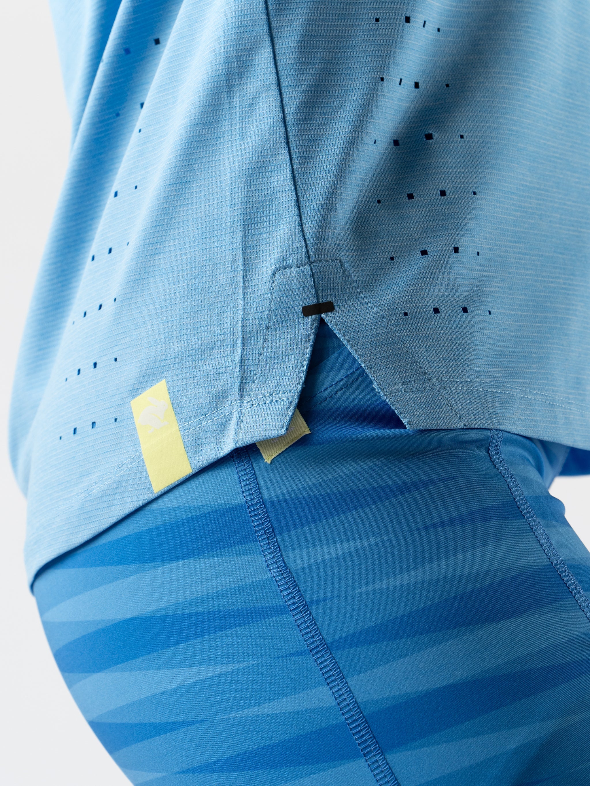 Race Pace Tee SS - Women by Rabbit in light blue with laser-cut perforations for breathability, semi-relaxed fit for running and training