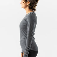 Outrun - Women by Rabbit in dark grey midweight wool knit top, odor-resistant, quick-drying base layer ideal for cold weather running