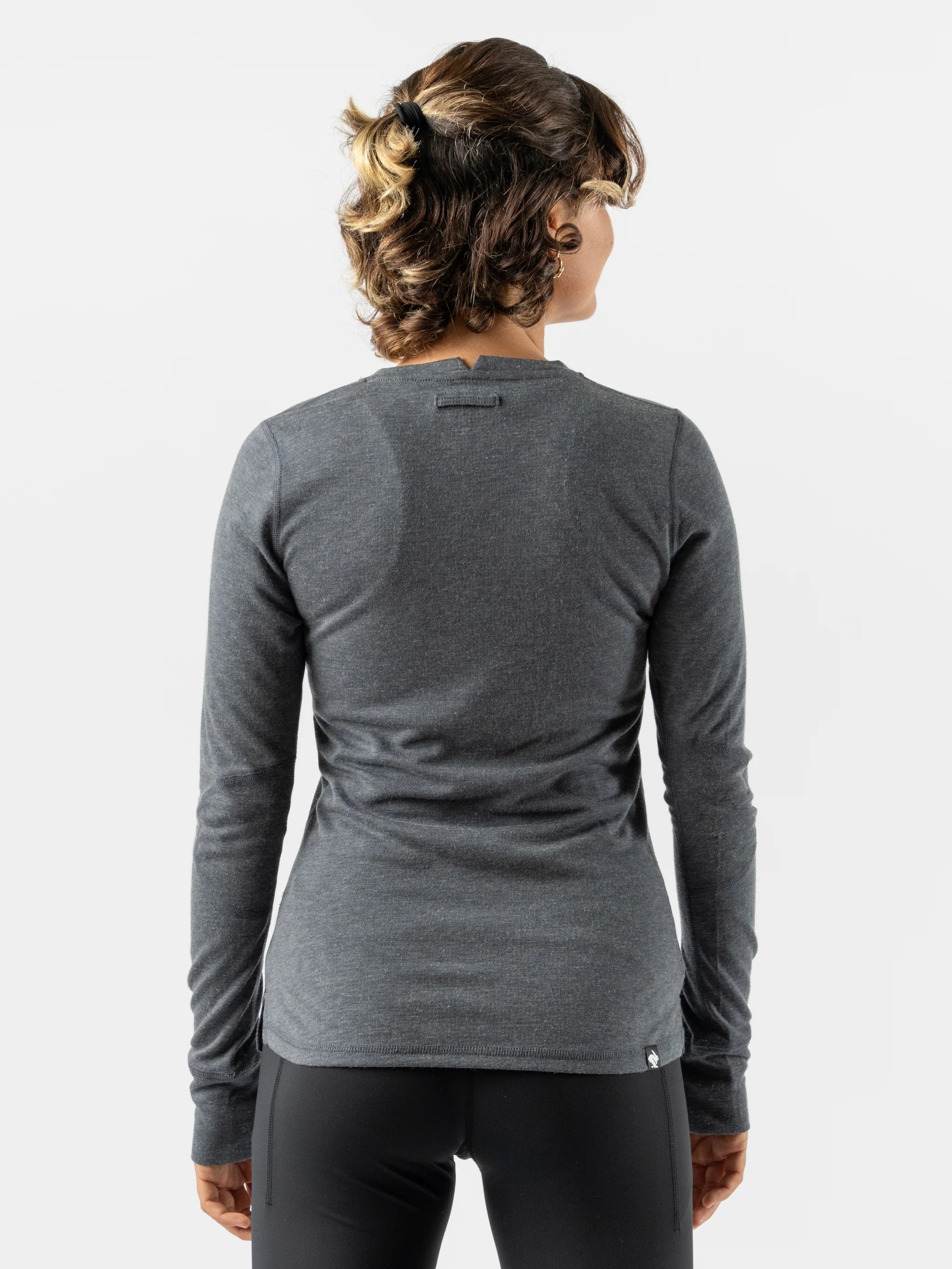 Outrun - Women by Rabbit in dark grey midweight wool blend top that regulates temperature and resists odor, ideal for cold weather running