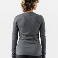 Outrun - Women by Rabbit in dark grey midweight wool blend top that regulates temperature and resists odor, ideal for cold weather running