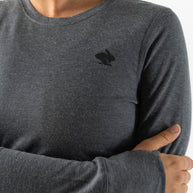 Outrun - Women by Rabbit in charcoal grey, midweight wool blend top that resists odor, dries quickly, and regulates temperature for cold weather running