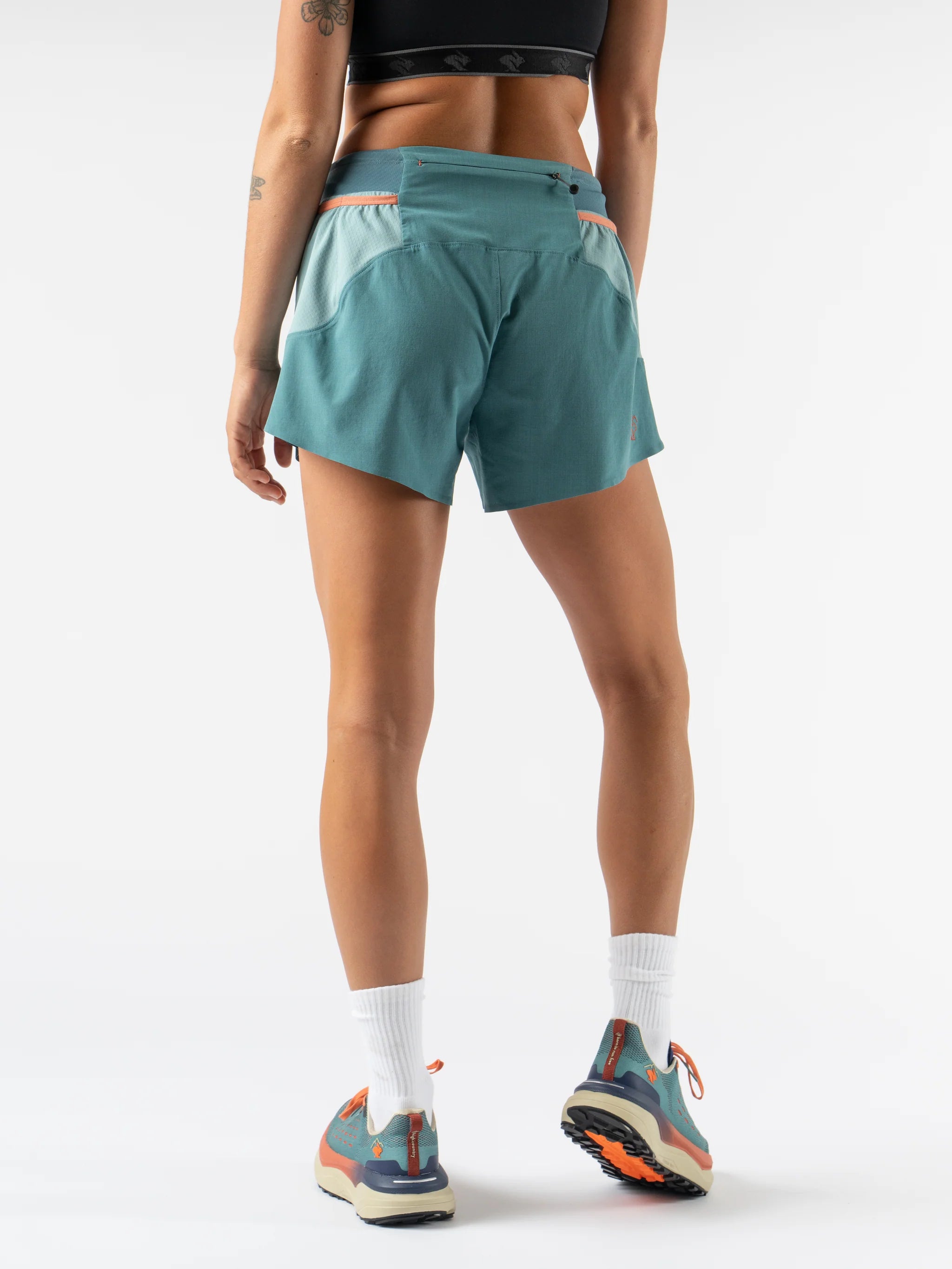 FKT 4 - Women by Rabbit in teal with light blue panels, technical stretch shorts with semi-relaxed fit, lightweight and breathable for trail running