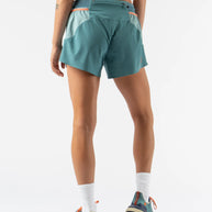 FKT 4 - Women by Rabbit in teal with light blue panels, technical stretch shorts with semi-relaxed fit, lightweight and breathable for trail running