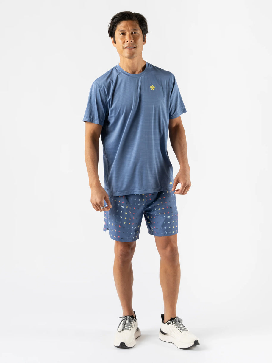 UPF Tee SS - Men by Rabbit in moonlight blue lightweight jersey with UPF 50 and laser-cut perfs, ideal for sun protection and running