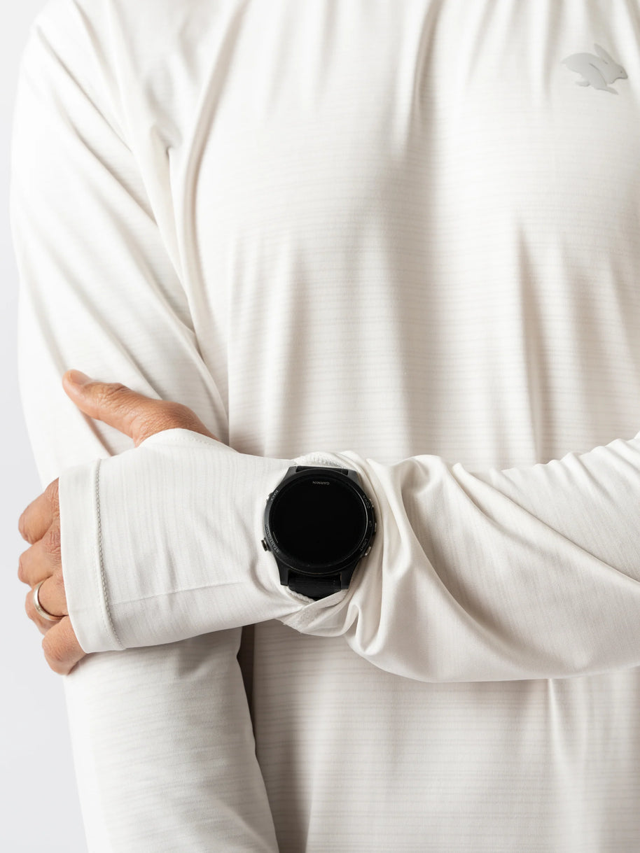 UPF Tee LS - Men by Rabbit in white, lightweight breathable long sleeve with UPF 50 and cooling laser-cut perfs for sunny runs