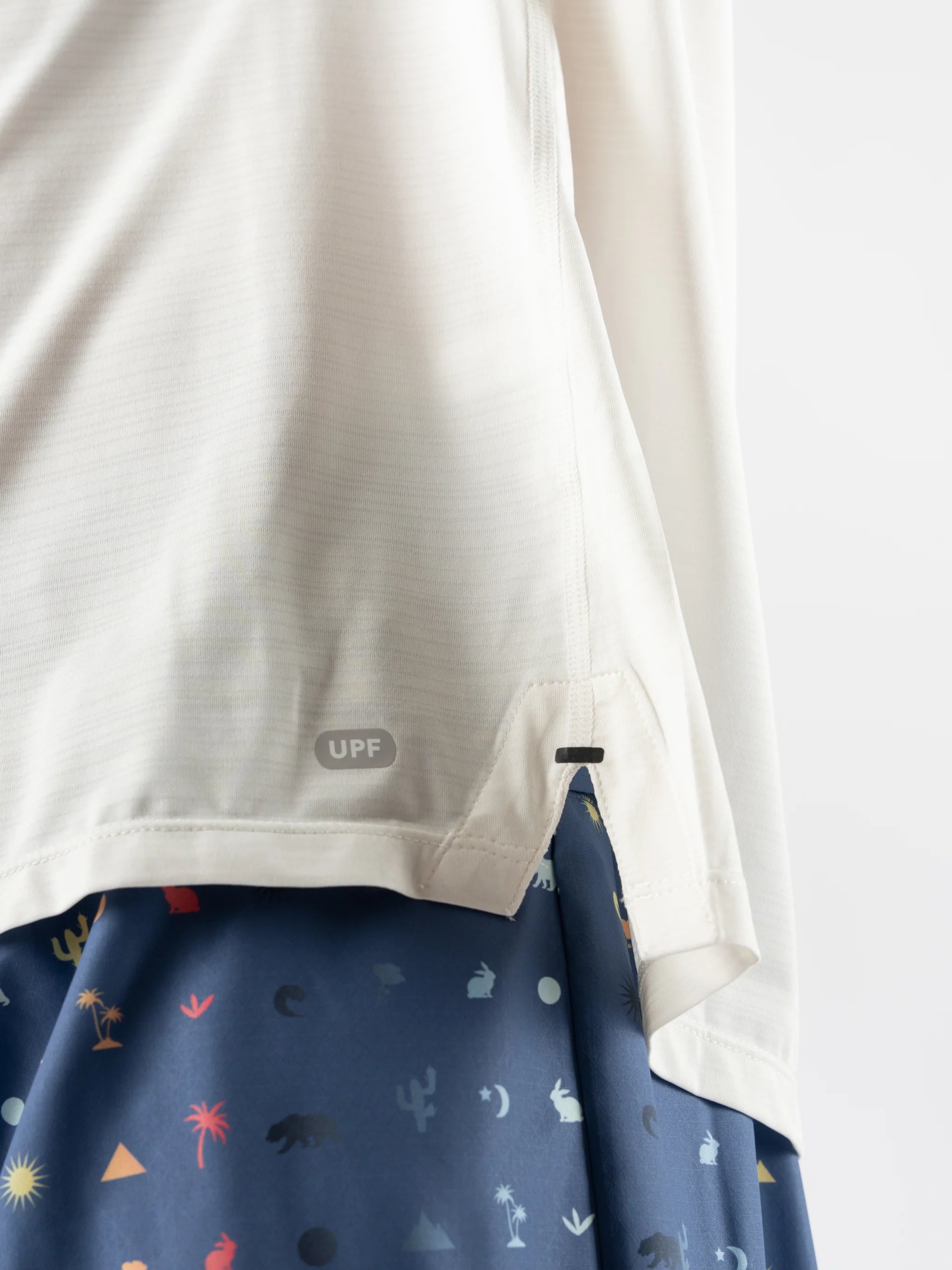 UPF Tee LS - Men by Rabbit in off-white lightweight, breathable long sleeve with UPF 50 and laser-cut perfs for cooling.