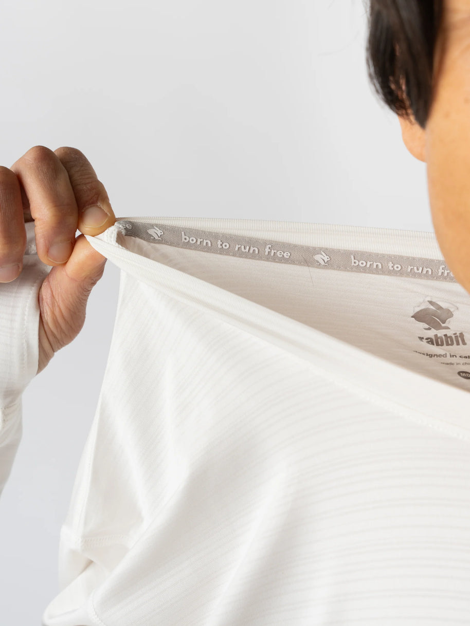 UPF Tee LS - Men by Rabbit in white, lightweight breathable long sleeve shirt with UPF 50 and laser-cut vents for running