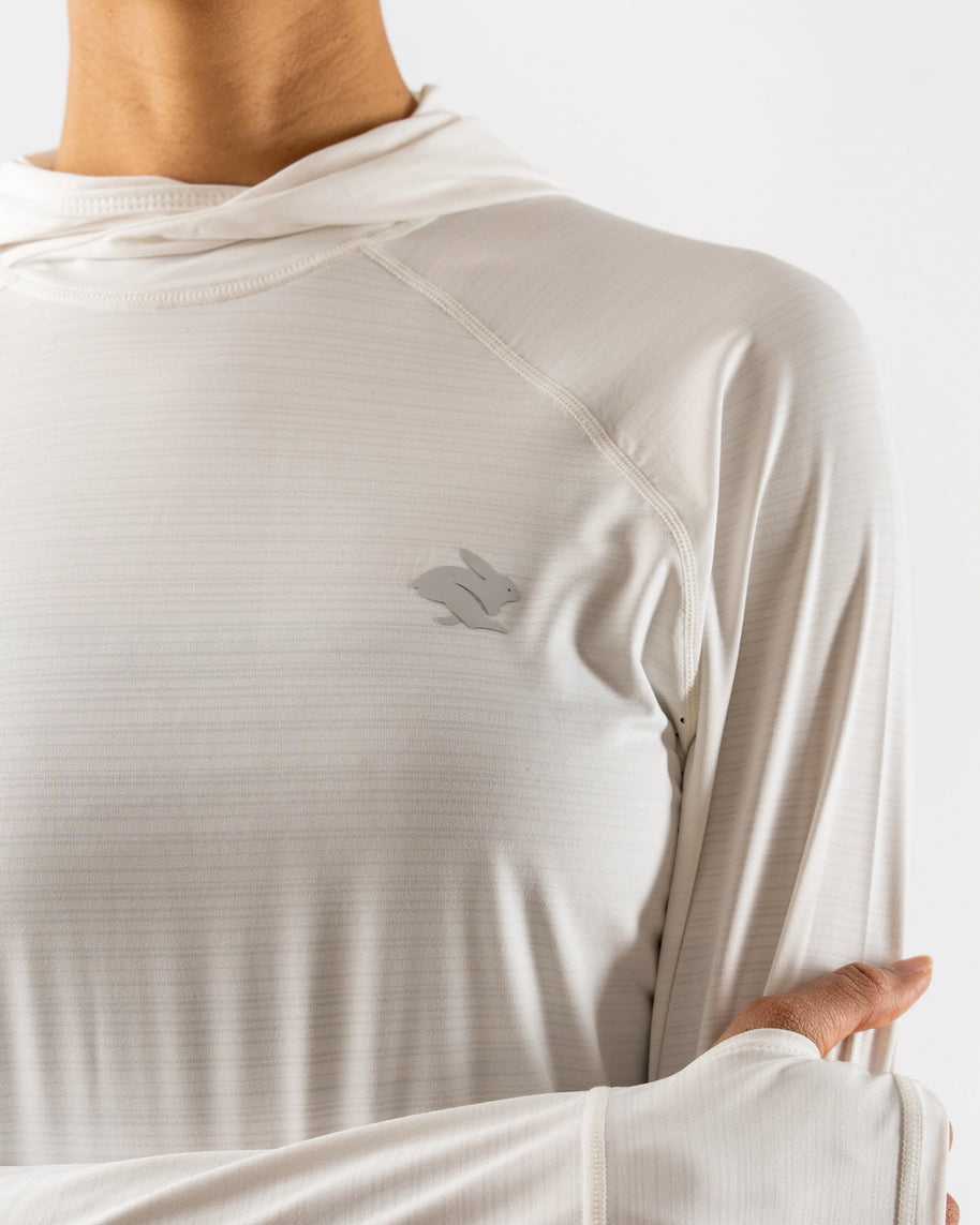 UPF Deflector 2.0 - Women by Rabbit in light beige, lightweight jersey top with UPF 50 and laser-cut ventilation for sun protection and running