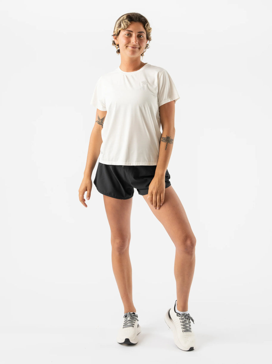 UPF Tee SS - Women by Rabbit in white, lightweight breathable top with UPF 50 protection and laser-cut vents for running outdoors