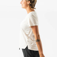 UPF Tee SS - Women by Rabbit in off-white, lightweight jersey with laser-cut underarm perfs, UPF 50 protection, ideal for sun-safe running and outdoor use