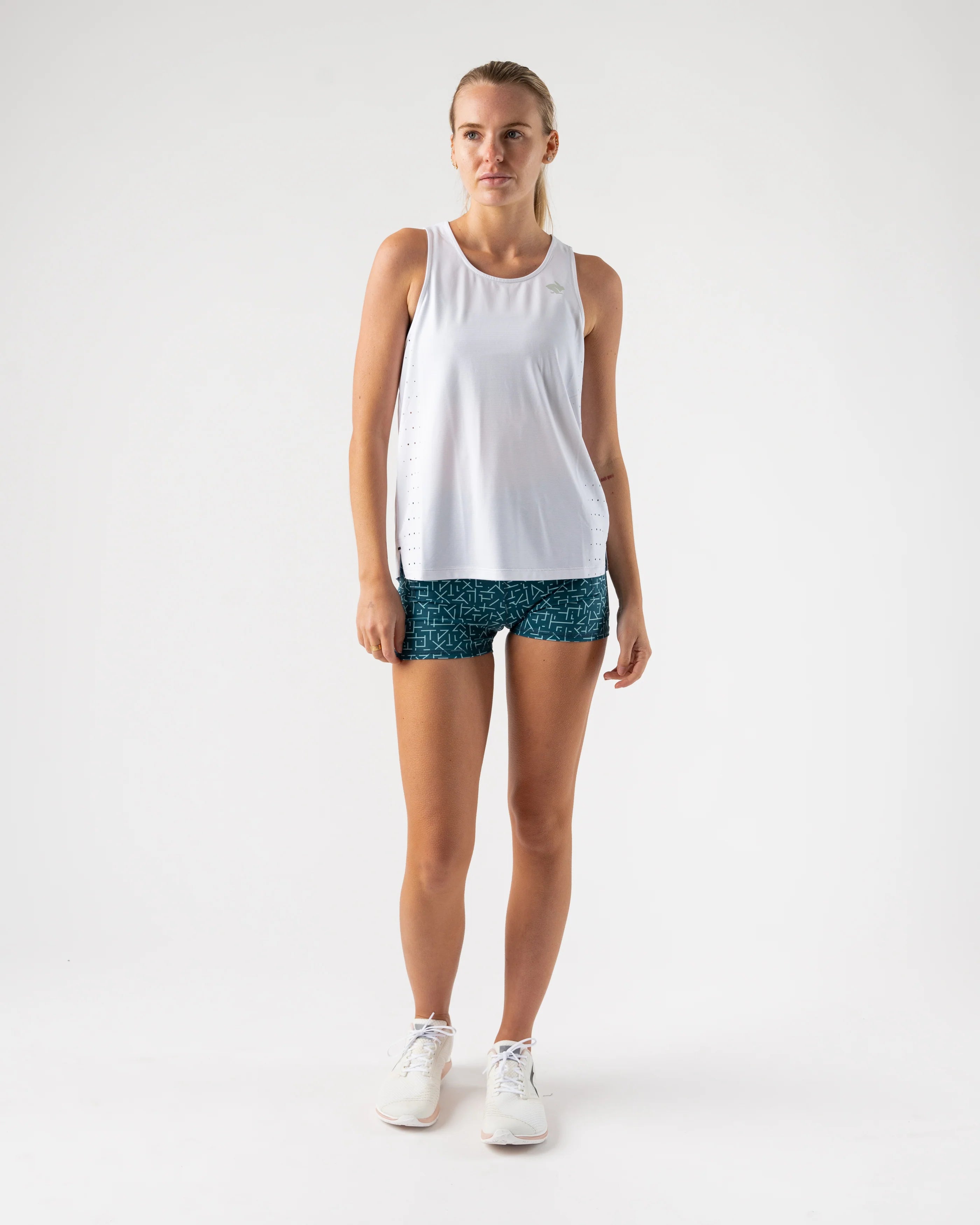 Race Pace Tank - Women by Rabbit in white with breathable laser-cut square perfs, semi-relaxed fit for running and training use