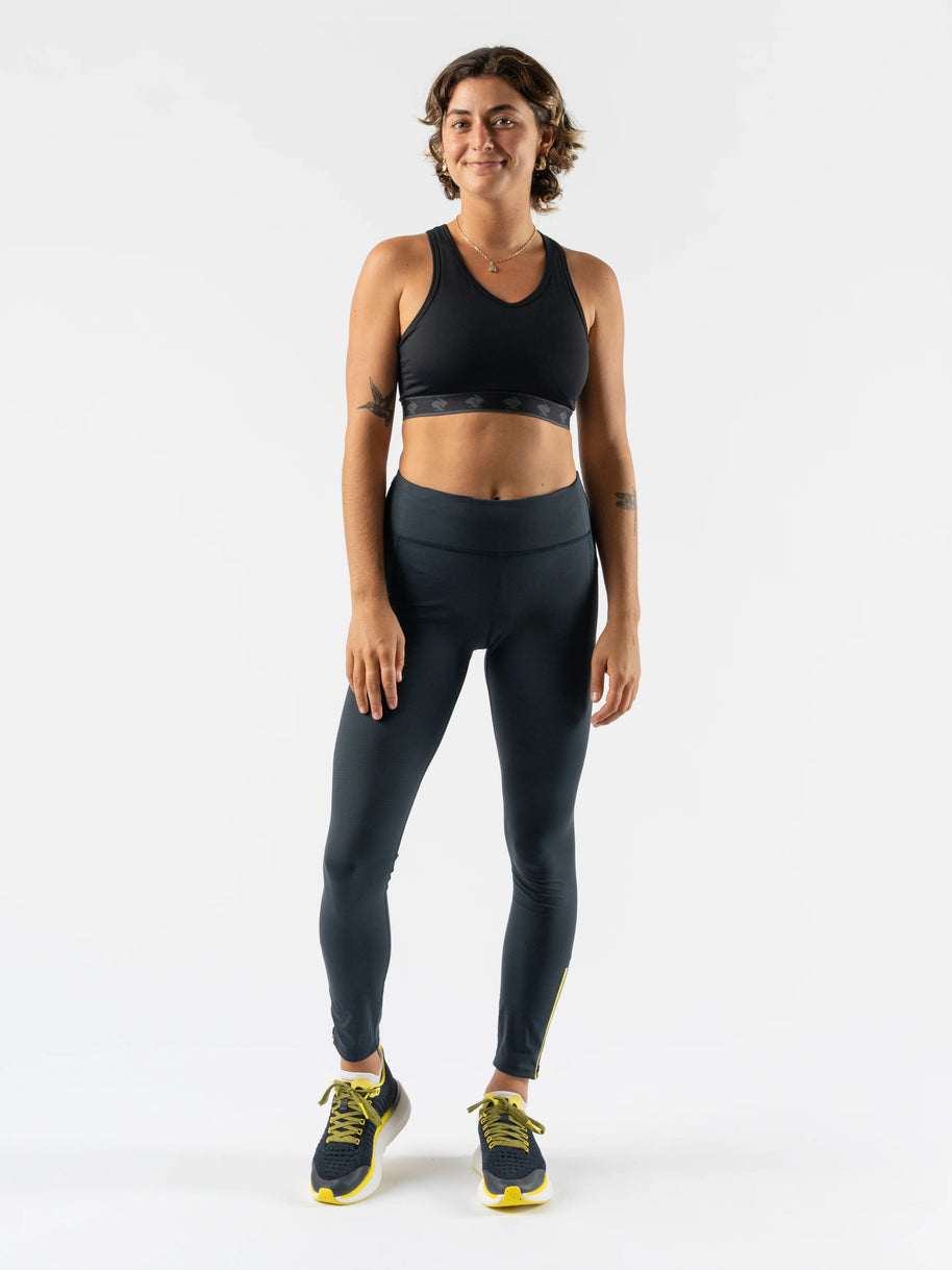 Low Light Speed Tights - Women by Rabbit in dark grey with reflective print, compressive fit, laser-cut perfs, and five pockets for running