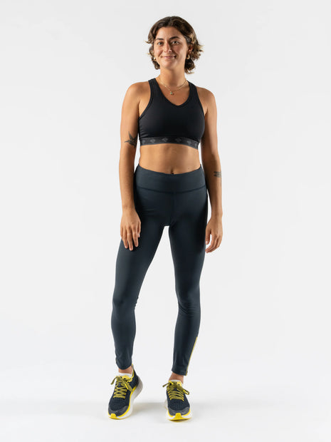 Low Light Speed Tights - Women by Rabbit in dark grey with reflective print, compressive fit, laser-cut perfs, and five pockets for running