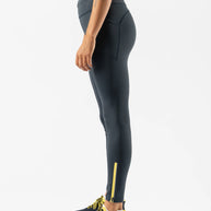 Low Light Speed Tights - Women by Rabbit in dark grey with 360° reflective print, compressive fit, laser-cut perfs, and five pockets for safe running
