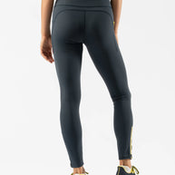 Low Light Speed Tights - Women by Rabbit in dark grey with 360° reflective print, compressive fit, laser-cut perfs, and five pockets for running safety