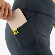 Low Light Speed Tights - Women by Rabbit in black with five pockets, compressive fit, reflective print for safe running in low light conditions