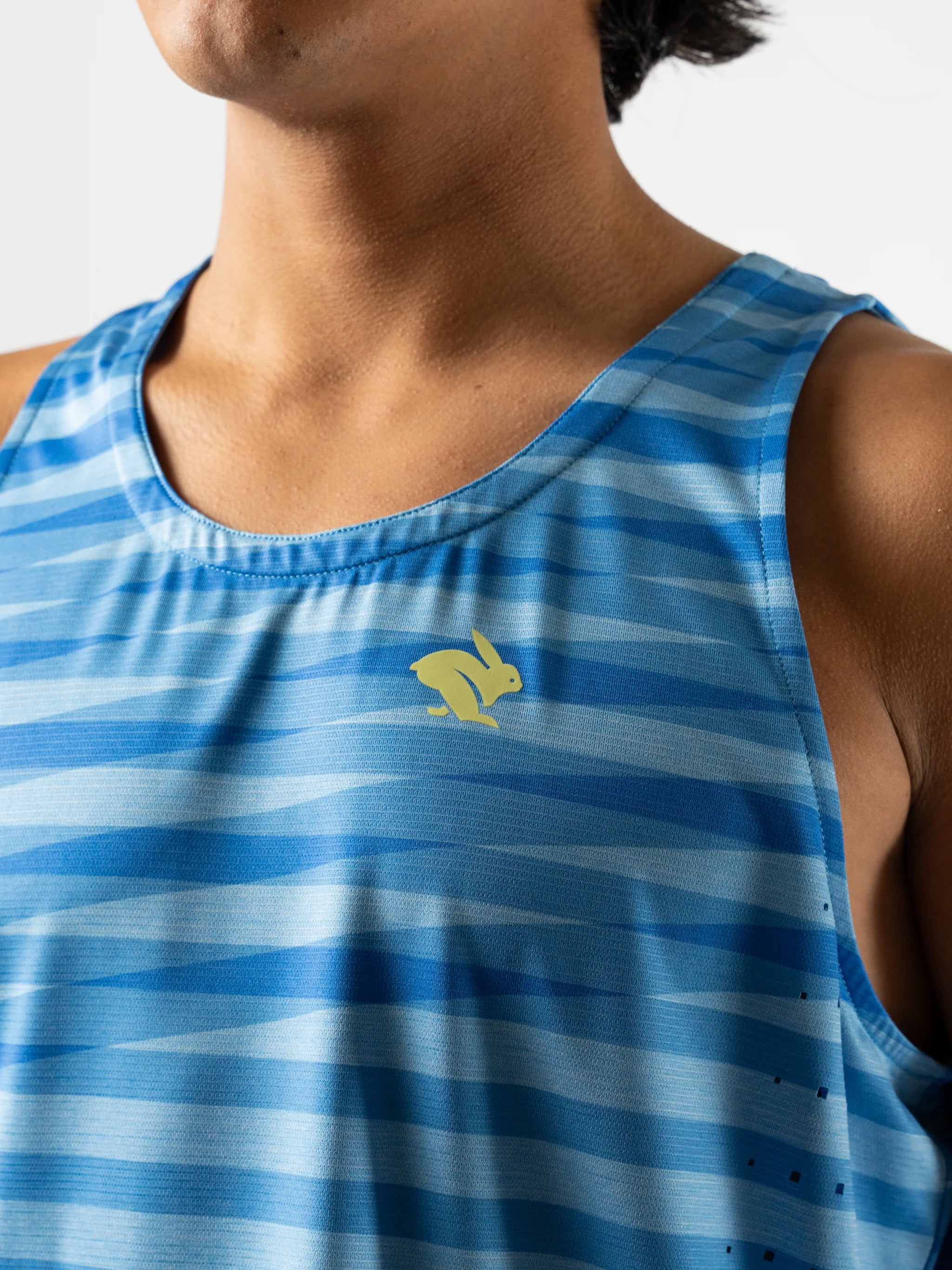 Race Pace Tank - Men by Rabbit in blue striped pattern with laser-cut ventilation and breathable microtextured fabric for running and training