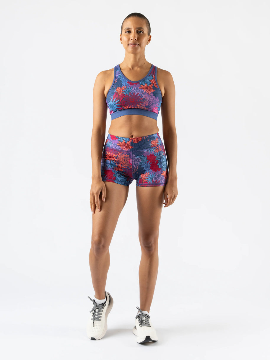 Utili Bra-Vo by Rabbit in blue and red floral pattern, multifunctional sports bra with laser-cut pocket, ideal for running and active women