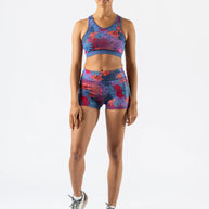 Utili Bra-Vo by Rabbit in blue and red floral pattern, multifunctional sports bra with laser-cut pocket, ideal for running and active women