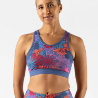 Utili Bra-Vo by Rabbit in blue and red floral pattern, multifunctional sports bra with laser-cut pocket for secure running essentials