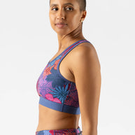 Utili Bra-Vo by Rabbit in blue and pink floral print, multifunctional sports bra with laser-cut back pocket minimizing bounce for running