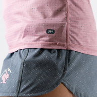 UPF Deflector 2.0 - Women by Rabbit in pink lightweight jersey with laser cut perfs, breathable sun protection top for running and outdoor use