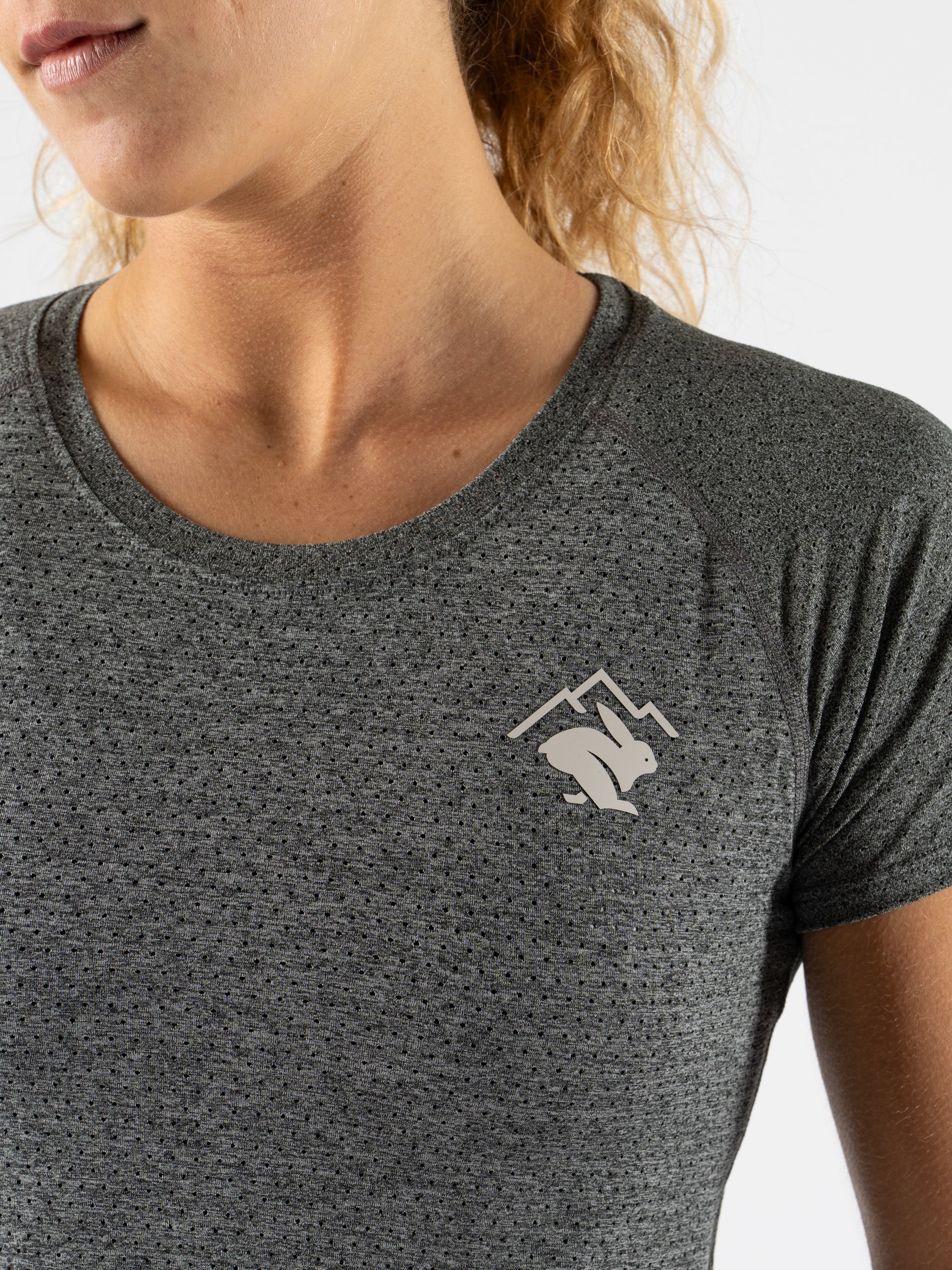 EZ Tee Perf SS Trail - Women by Rabbit in dark grey, lightweight breathable trail running top with perforations for comfort and moisture control
