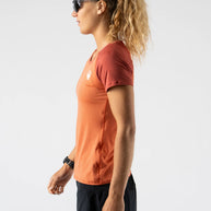 EZ Tee Perf SS Trail - Women by Rabbit in rust orange lightweight breathable perforated running shirt ideal for trail running outdoors