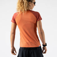 EZ Tee Perf SS Trail - Women by Rabbit in rust orange with breathable perforations, soft lightweight running top ideal for trail running and outdoor use