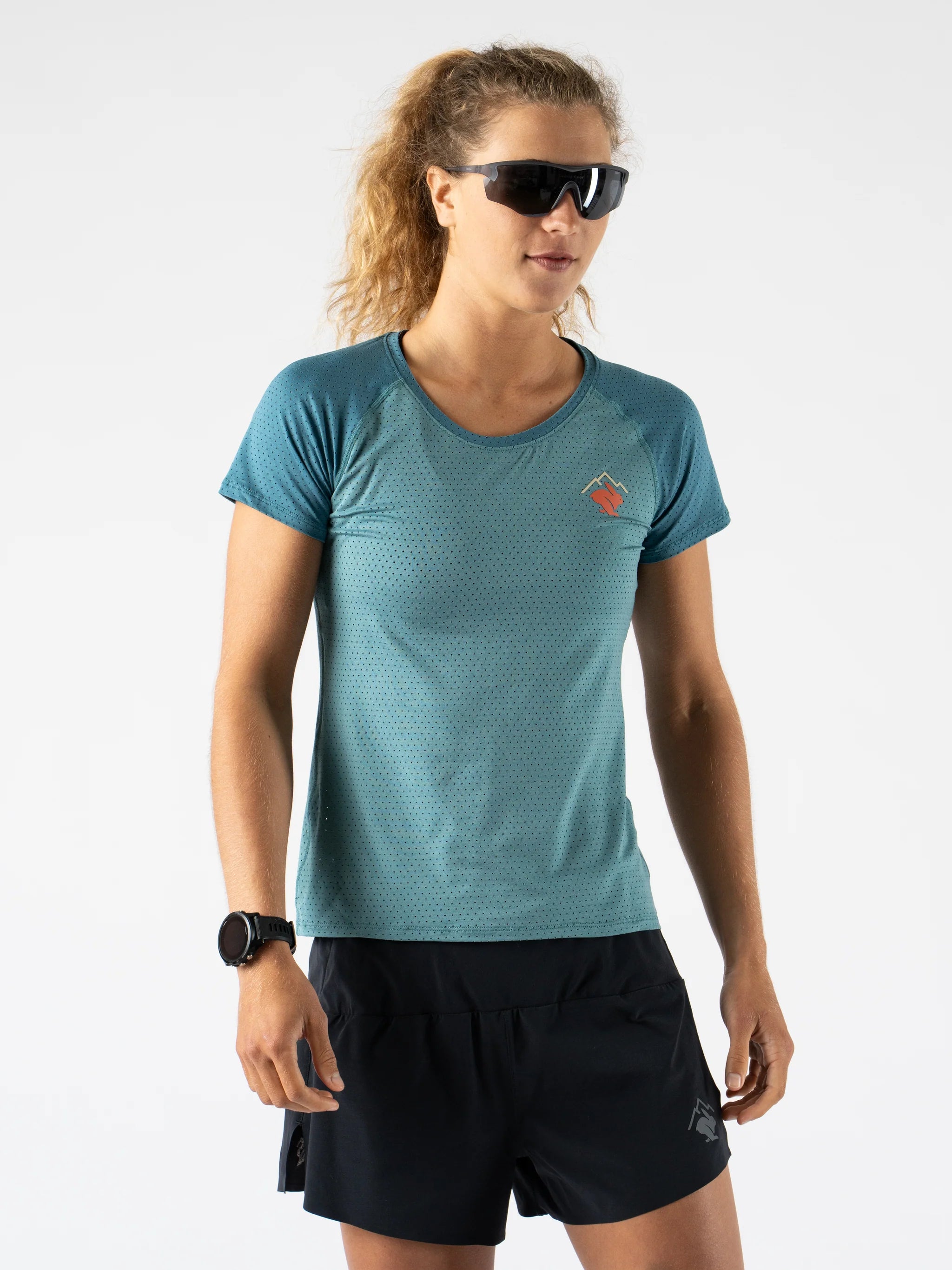 EZ Tee Perf SS Trail - Women by Rabbit in teal with perforations, breathable lightweight running top ideal for trail running and outdoor use